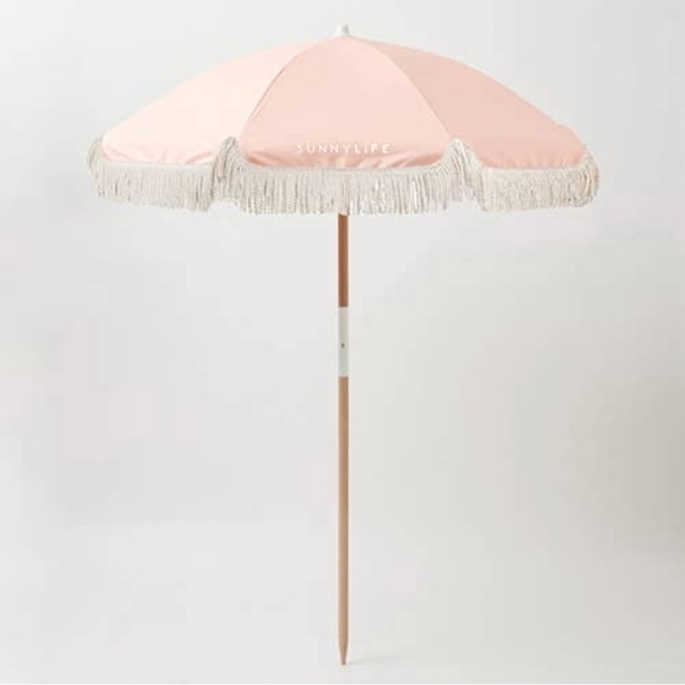 Sunnylife beach umbrella in the color salmon